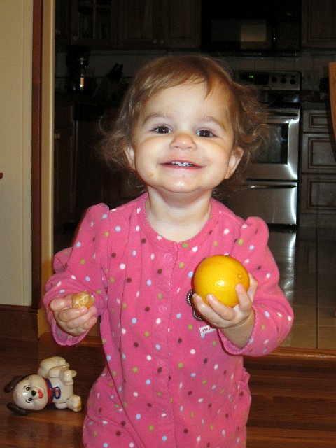 IMG_0543b.jpg - Catherine found a new food that she enjoys, clementines!