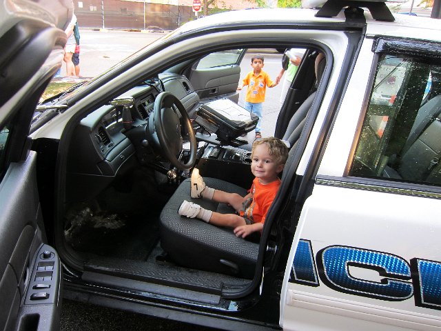 IMG_4394.jpg - The kids got an opportunity to sit in police cruisers, motorcycles, construction vehicles, an ambulance and fire truck.