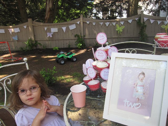 IMG_9639.jpg - Catherine is patiently awaiting the cupcake-eating part of the festivities!