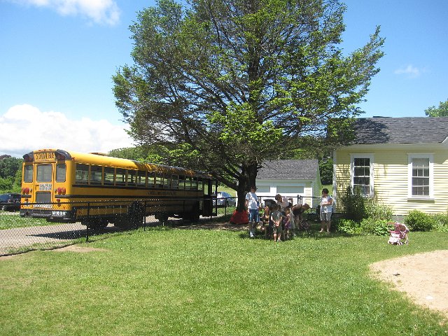 IMG_9953.jpg - There it is, the big yellow school bus, the object of so much excitement for these kids.
