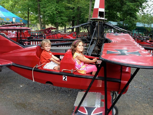 IMG_3909.jpg - The Burkett kids on the Red Baron.
