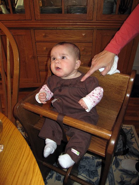 IMG_4071b.jpg - She's not quite ready for her 'big-girl high chair' yet.