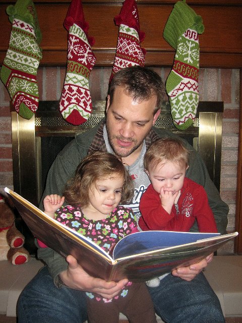 IMG_2275b.jpg - Our Christmas Eve tradition was a little more challenging this year ... Dad had his hands full trying to balance two kids and read 'Twas the Night Before Christmas'.