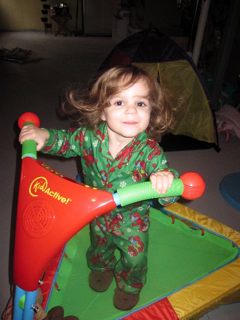 IMG_2411b.jpg - Catherine's last gift was so big it will need to stay in the basement ... a musical trampoline.  How did Santa know she was the perfect gal for that toy?