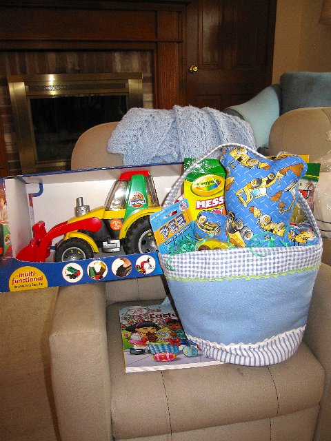 IMG_4777.jpg - The Easter Bunny found us (even though we were away for the weekend) because this truck-themed basket of goodies was waiting for Nathan.