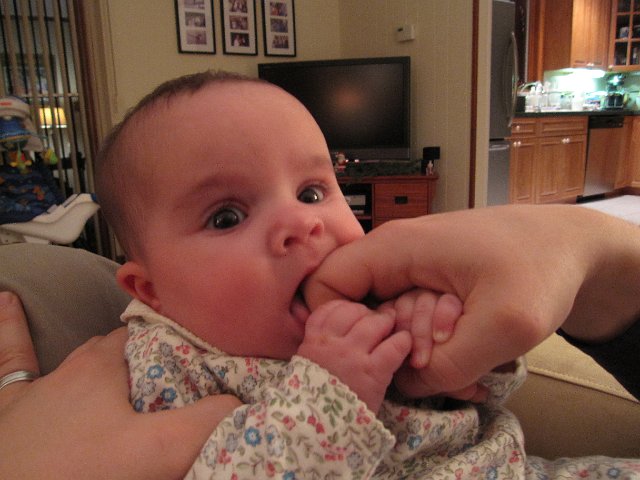 IMG_4595.JPG - These days Catherine even sneaks in Dad's knuckle to use for teething purposes!!