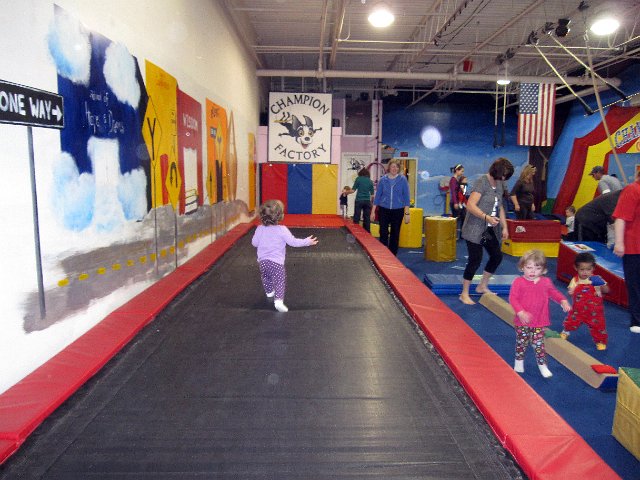 IMG_0638b.jpg - We went to The Champion Factory and tried out a class called "Diaper Daredevils".  It's difficult to get photos of a girl on the run!  Here she was sprinting down the trampoline runway and having a blast!!