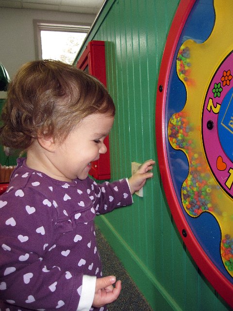 IMG_0664b.jpg - Catherine really enjoyed the spinning bead board, I guess because it made lots of noise!