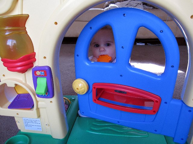 IMG_7547b.jpg - Catherine is exploring her latest toy, the Fisher Price Laugh and Learn Home.