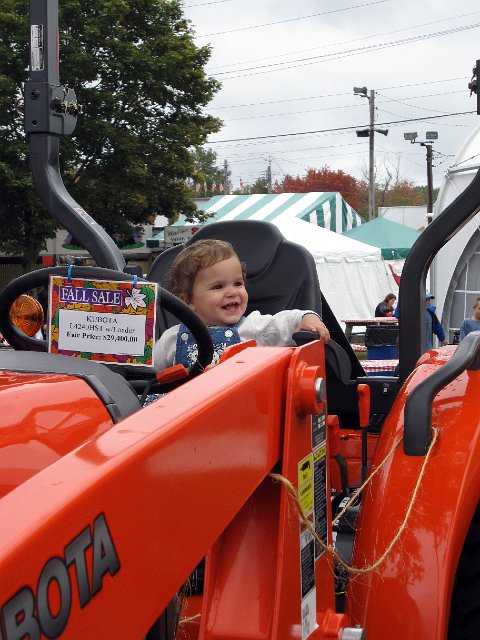 IMG_0293b.jpg - Our little country girl perched in a big Kubota tractor at the Topsfield Fair.