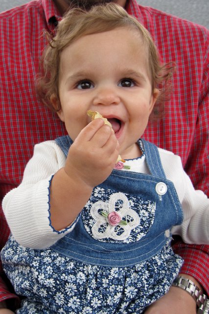 IMG_0320c.jpg - She really enjoyed the fried potato chips and had her first taste of funnel cakes!