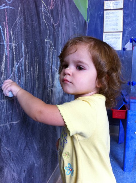 IMG_0084b.jpg - Our little artist at work ... she's so 'in the moment' she doesn't realize she's wearing it on her nose!