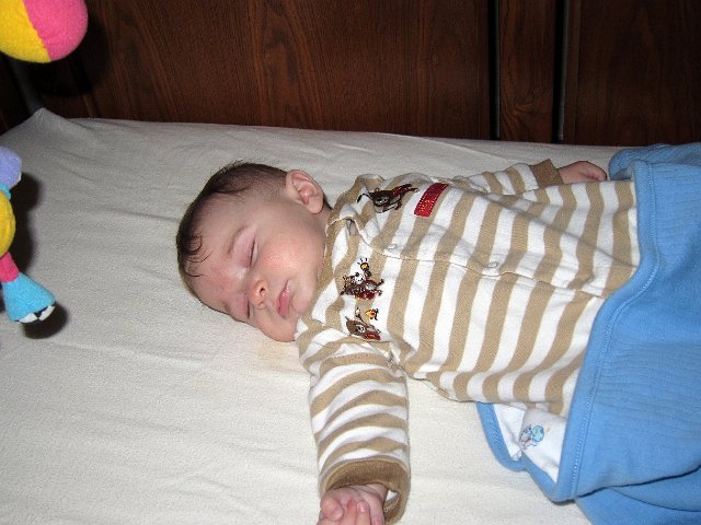 IMG_2441b.jpg - Nathan's first snooze in his crib .. he was ready to bust through the walls of the bassinet!