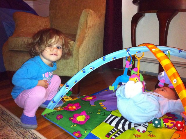 IMG_0168b.jpg - This is the beginning stages of them playing together I guess.  Suddenly Catherine is re-interested in all of the baby toys.