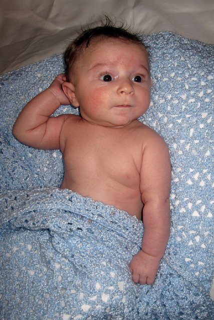 IMG_1396b.jpg - I wanted to take some photos of Nathan with the afghan that Nana had made for him and had no idea he was going to be such a studly model!!