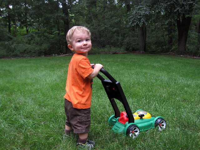 IMG_5741b.jpg - It looks like fun now, but wait until he has to mow the lawn to earn his allowance.