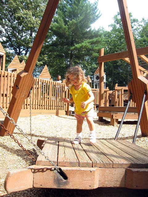 IMG_5787b.jpg - We checked out another playground (first time with Nathan), The Field of Dreams in Salem, NH.  Here is Catherine attempting the wobbly station ... the wobbly station won.