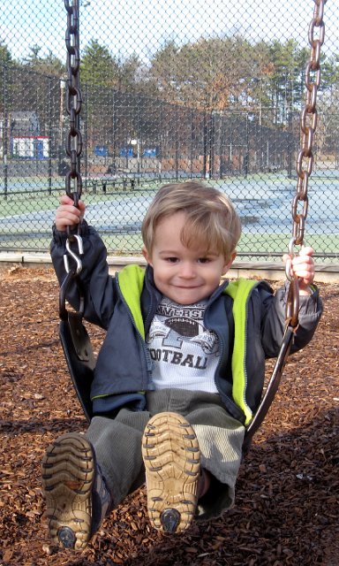 IMG_7477.jpg - Nathan on his first solo ride on a real swing!