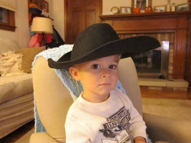 IMG_4104.jpg - But of course you need to wear your cowboy/cowgirl hats when watching "Elmo in the Wild, Wild West"!