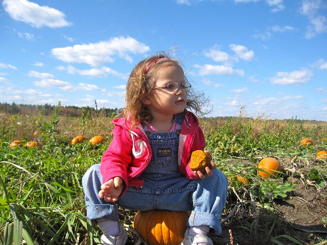 IMG_6605.JPG - Catherine decided to pop a squat on a pumpkin and nibble on her pumpkin muffin.