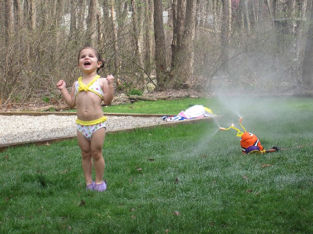 IMG_9149.jpg - Catherine is letting the neighborhood know how excited she is to be playing in the water.