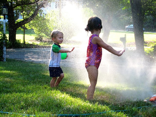 IMG_1493.jpg - Some sprinkler fun is a great way to entertain children while simultaneously watering the lawn.