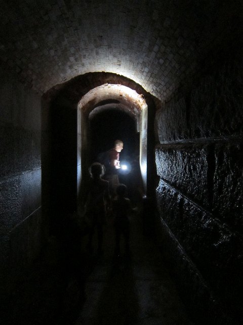 IMG_4526.jpg - The Romboldi & Burkett clans heading through the Corridor of Dungeons (this time, they were prepared with flashlights).  Luckily, no Ghost of the Lady in Black was there to greet us!!!