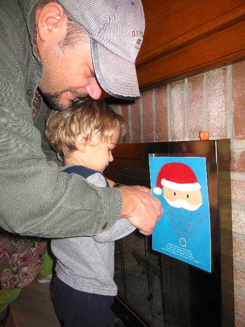 IMG_3122.jpg - Today was also the day we kicked off a countdown to Christmas by placing a cottonball on Santa's beard.  When it's full, Santa will come that night!