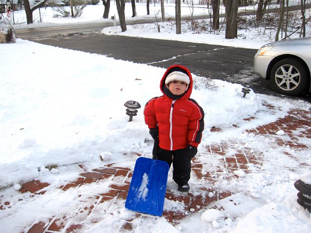 IMG_3525.jpg - Nathan is pretty excited about his shovel. (He doesn't realize all the future chores that go with it.)