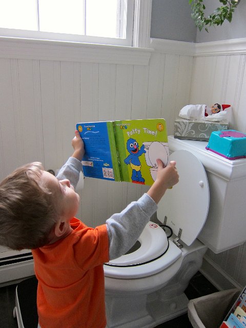 IMG_6117.jpg - Here Nathan stopped in to show a sleepy Alfie a book.