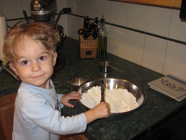 IMG_9479.jpg - My little helper with our new favorite recipe for chocolate chip cookies.  These days it's "NeNe help you" with everything!