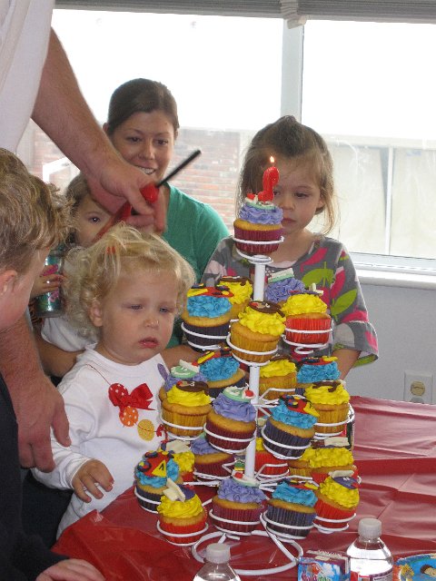 IMG_2577.jpg - There's the birthday girl with her cupcake tower.