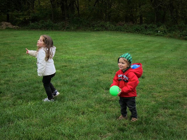 IMG_5506.jpg - Kirra enjoyed "hiding" the ball from Nathan (in his hood).  What a sneaky lil gal!