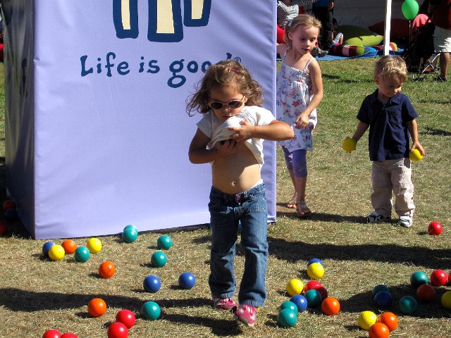 IMG_2124.jpg - Catherine spotted a little girl using her shirt as a way to carry more balls and jumped on that bandwagon (kinda sorta).