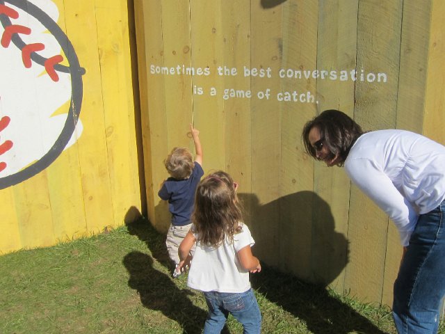 IMG_5380.jpg - 100% of all the funds raised from the Festival will go directly to The Life is good Playmakers, the nonprofit committed to helping kids overcome poverty, violence and illness.   (Catherine was practicing her reading of all the inspirational billboard quotes.)