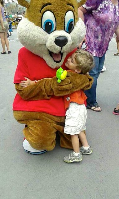 1375824250886.jpg - Nathan sharing a little love with a mascot, awwww.