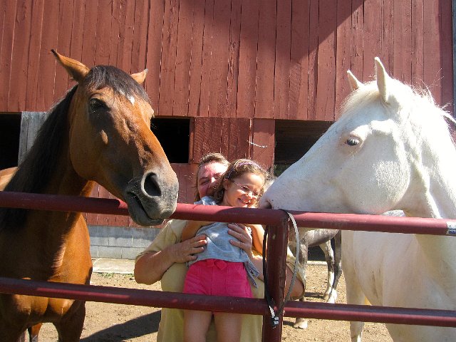 IMG_7509.jpg - Catherine receiving horse kisses from both sides!