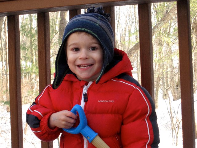 IMG_4225.jpg - The snow on the deck provided numerous days of entertainment for this guy.  He loves to shovel it, rake it and play with his big dump truck and bulldozers in it.