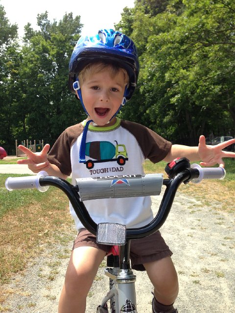 IMG_3798.jpg - Yes, this silly kid is still wearing to his favorite pajama top to go bike riding at the park.  He refused to take it off.