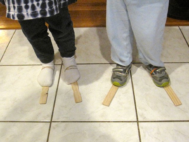 IMG_6341.jpg - All you need are some paint sticks, rubber bands and the white kitchen floor to create a snow skiing scene.