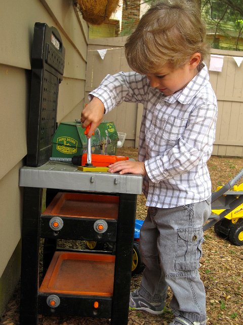 IMG_6117.jpg - Even at a birthday party, Nathan can find some tools to play with.