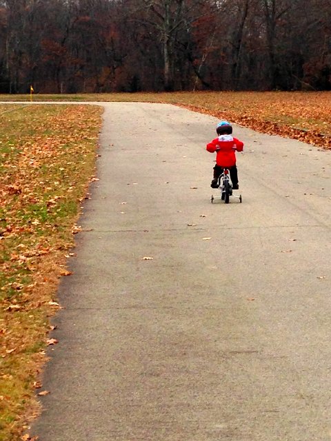 IMG_5141.jpg - Meanwhile, Nathan heads to the park for some bicycle time.