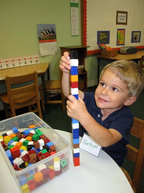 IMG_8079.jpg - Nathan gets comfortable with all the learning stations they have to offer.