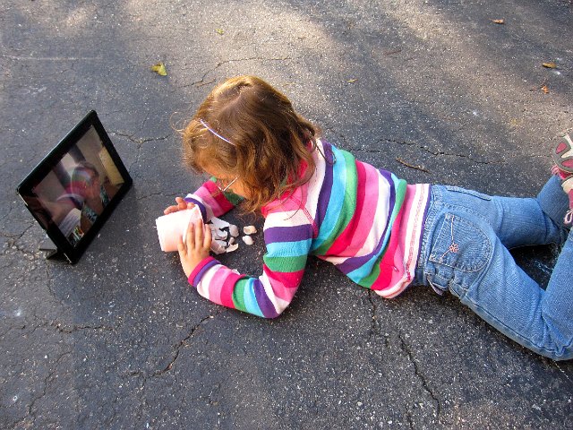 IMG_8226.jpg - Catherine and Nana have a sea shell discussion via Skype on a beautiful afternoon.