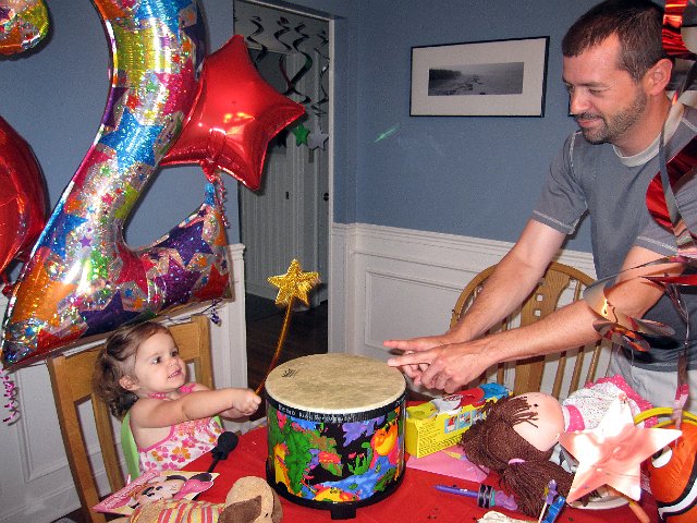 IMG_0969b.jpg - Jamming with Uncle Tom on one of her new toys, a drum.