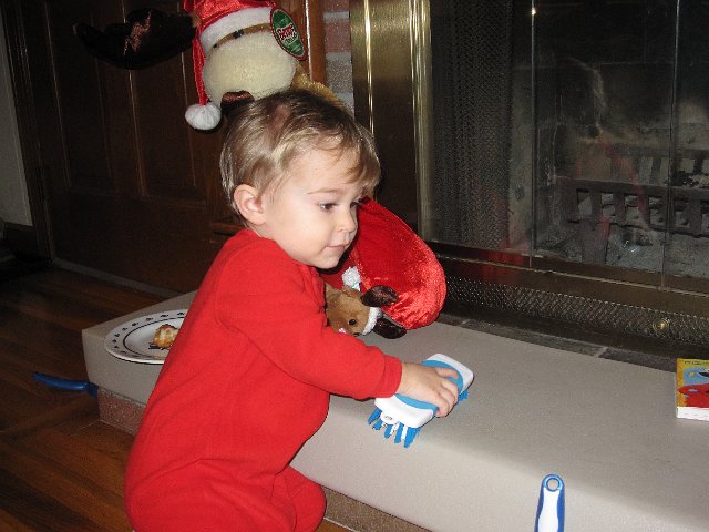 IMG_7595.jpg - Nathan likes to clean and is very excited to have his very own scrub brush, mini dust pan and broom.  (I was informed that this behavior does not last unfortunately.)