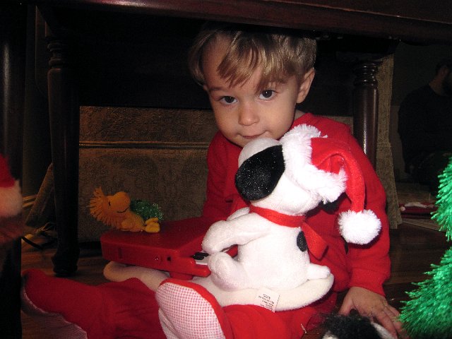 IMG_7766.jpg - Nathan hiding out under the end table to have some time with the Snoopy toy.