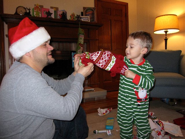 IMG_3359.jpg - Nathan was just making sure he got everything out of his stocking.