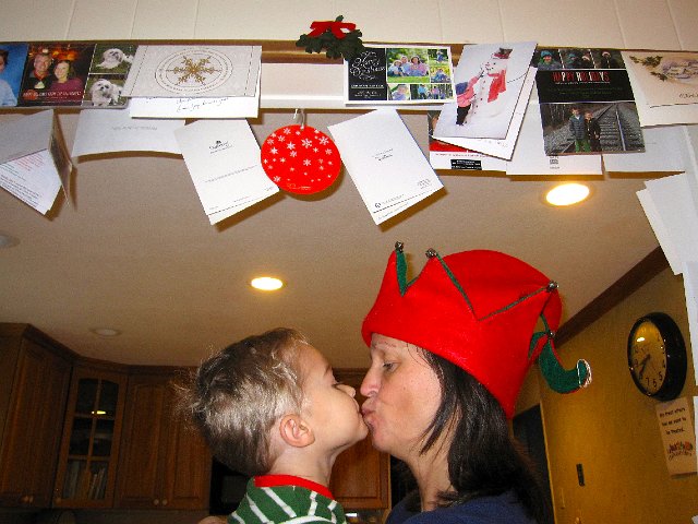 IMG_3381.jpg - Ahhh, a little moment under the mistletoe with Mom's favorite man.